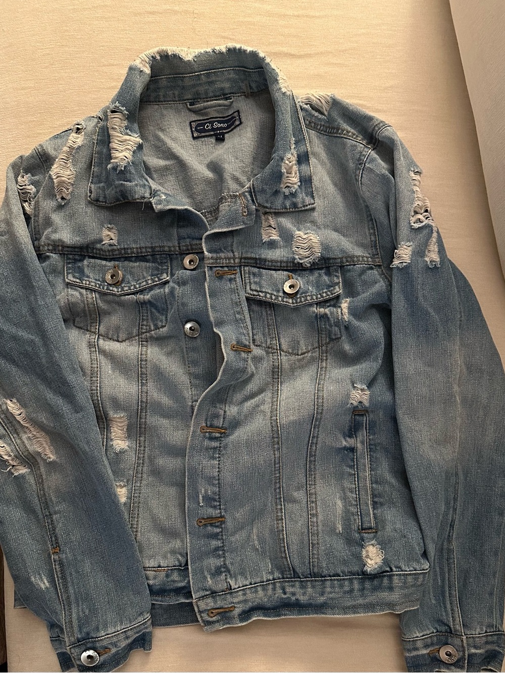 Distressed denim jacket